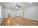 Bright bedroom featuring hardwood floors and doorways to a closet and bathroom at 20635 Queensdale Dr, Cornelius, NC 28031