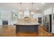 Spacious kitchen with granite countertops, stainless steel appliances, and a large center island at 20635 Queensdale Dr, Cornelius, NC 28031