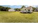 Expansive grassy backyard, with a view of home's rear and neighboring property at 210 Marshall St, Rock Hill, SC 29730