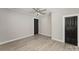 Spacious bedroom with a ceiling fan, fresh paint, modern floors and black doors at 210 Marshall St, Rock Hill, SC 29730