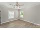 Bedroom featuring fresh paint, ceiling fan, new windows and contemporary flooring at 210 Marshall St, Rock Hill, SC 29730