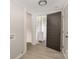 Neutral hallway with view of bathroom with white vanity and fixtures at 210 Marshall St, Rock Hill, SC 29730