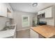 Modern kitchen with stainless steel appliances and breakfast bar with butcherblock top at 210 Marshall St, Rock Hill, SC 29730
