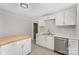 Bright kitchen featuring stainless steel appliances, white cabinets, and a butcher block breakfast bar at 210 Marshall St, Rock Hill, SC 29730