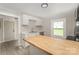 Bright kitchen featuring stainless steel appliances, white cabinets, and a butcher block breakfast bar at 210 Marshall St, Rock Hill, SC 29730