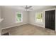 Inviting living room featuring fresh paint, a black interior door, and durable laminate floors throughout at 210 Marshall St, Rock Hill, SC 29730
