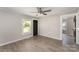 Inviting living room featuring fresh paint, a black interior door, and durable laminate floors throughout at 210 Marshall St, Rock Hill, SC 29730