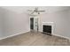 Inviting living room featuring fresh paint, a decorative fireplace, and durable laminate floors throughout at 210 Marshall St, Rock Hill, SC 29730