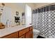 Bathroom with a stylish shower curtain, vanity, and sink at 219 Mccord St, Charlotte, NC 28216