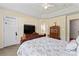 Comfortable bedroom with a tray ceiling, neutral walls and carpet, and lots of storage at 219 Mccord St, Charlotte, NC 28216