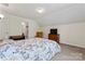 Cozy bedroom with slanted ceiling, comfortable bed, and a classic wooden dresser, offering a tranquil retreat at 219 Mccord St, Charlotte, NC 28216