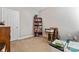 Bright bedroom featuring a bookcase, printer, and neutral walls, providing a versatile living space at 219 Mccord St, Charlotte, NC 28216