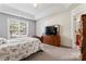 Spacious bedroom with large window and tray ceiling provides natural light at 219 Mccord St, Charlotte, NC 28216