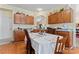Cozy dining area adjacent to the kitchen, with wood cabinets and a view into another living space at 219 Mccord St, Charlotte, NC 28216