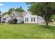 Charming single-Gathering home with manicured lawn, and a two-car garage at 219 Mccord St, Charlotte, NC 28216