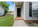 Inviting front entrance with a well-maintained walkway and appealing curb appeal at 219 Mccord St, Charlotte, NC 28216