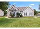 Charming home with manicured front lawn, attractive landscaping, and inviting curb appeal at 219 Mccord St, Charlotte, NC 28216