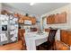 Well-lit kitchen featuring wood cabinets, stainless steel appliances, and an adjacent dining area at 219 Mccord St, Charlotte, NC 28216