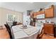 Spacious eat-in kitchen with wood cabinets, white appliances, and a view to the outdoors at 219 Mccord St, Charlotte, NC 28216