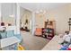 Elegant living room with decorative chandelier, comfortable seating, and open floor plan at 219 Mccord St, Charlotte, NC 28216