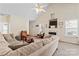 Inviting living room with a plush sofa, fireplace, mounted television, and neutral color scheme at 219 Mccord St, Charlotte, NC 28216