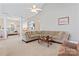 Open living room with neutral tones, plush carpet, and high ceilings for a cozy and inviting atmosphere at 219 Mccord St, Charlotte, NC 28216