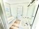 Bright bathroom featuring a double vanity, tub, and natural light at 2242 Shumard Cir, Indian Trail, NC 28079