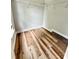 Walk-in closet with wood-look flooring and white shelving at 2242 Shumard Cir, Indian Trail, NC 28079