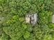 Aerial view of a secluded home surrounded by lush greenery and mature trees at 23 Tanglewood Rd, Clover, SC 29710