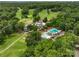 Breathtaking aerial view of the community center, surrounded by a pool, golf course, and lush green trees at 23 Tanglewood Rd, Clover, SC 29710