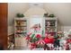 An attic room with shelves and a window, filled with Christmas decorations at 23 Tanglewood Rd, Clover, SC 29710