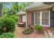 Charming backyard with brick patio, fountain, and lush landscaping, providing a tranquil retreat at 23 Tanglewood Rd, Clover, SC 29710