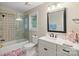 Bright bathroom with tiled shower, glass door, white vanity, and modern fixtures at 23 Tanglewood Rd, Clover, SC 29710