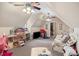 Large bonus room featuring twin beds, play area, dollhouse, and ample storage at 23 Tanglewood Rd, Clover, SC 29710