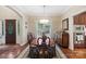Traditional dining room features a wood table, rug, and decorative chandelier, great for entertaining at 23 Tanglewood Rd, Clover, SC 29710