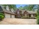 Charming brick home with a well-maintained front yard, a three-car garage, and a spacious driveway at 23 Tanglewood Rd, Clover, SC 29710