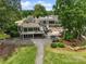 Gorgeous aerial view of the community center, including a patio, golf cart parking, and surrounding lawn at 23 Tanglewood Rd, Clover, SC 29710