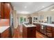 Spacious kitchen boasts hardwood floors, wood cabinets, stainless steel appliances, and granite countertops at 23 Tanglewood Rd, Clover, SC 29710