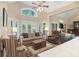 Bright living room with hardwood floors, plantation shutters, and an open layout to the kitchen at 23 Tanglewood Rd, Clover, SC 29710