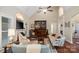 Bright living room featuring a fireplace, hardwood floors, and plenty of seating at 23 Tanglewood Rd, Clover, SC 29710