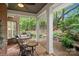 Charming covered patio with a swing, table, and chairs, perfect for outdoor relaxation at 23 Tanglewood Rd, Clover, SC 29710