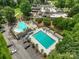 Lovely aerial view of the community pools, including lap lanes, surrounding green spaces, and mature trees at 23 Tanglewood Rd, Clover, SC 29710
