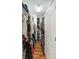 Organized walk-in closet with hardwood floors, shelving, and ample storage for clothes and accessories at 23 Tanglewood Rd, Clover, SC 29710