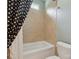 Cozy bathroom featuring a tiled shower and a classic black and white polka dot shower curtain at 237 Garvin Rd, McConnells, SC 29726