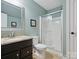 Modern bathroom with granite countertops, a framed mirror, and a glass enclosed walk-in shower at 237 Garvin Rd, McConnells, SC 29726