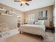 Comfortable bedroom with a plush bed, decorative shelves, and an ensuite bathroom at 237 Garvin Rd, McConnells, SC 29726