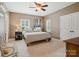 Bedroom features neutral colored walls, carpeted floors, fan, plantation shutters, and a closet at 237 Garvin Rd, McConnells, SC 29726
