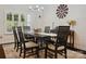 Formal dining room with modern chandelier, dark wood table set, and neutral color palette at 237 Garvin Rd, McConnells, SC 29726