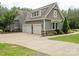 Charming home featuring a two-car garage, stone accents, and beautifully landscaped surroundings at 237 Garvin Rd, McConnells, SC 29726