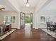 Grand foyer boasts dark wood floors, elegant columns, and an inviting view of the outdoors at 237 Garvin Rd, McConnells, SC 29726